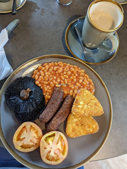 Vegetarian breakfast with eggs swapped for mushrooms. Oatmilk decaf latte at Three Trees in Swindon