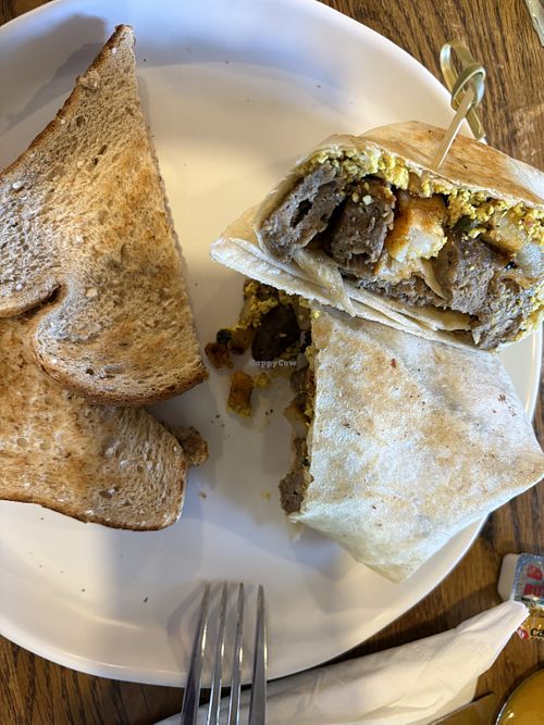 Mediterranean tofu scramble with vegan sausage, wrap and toast.   at Social Eats Cafe in Oneonta