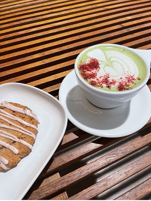 Fairy duster matcha with oat milk and strawberry rose cookie  at Presta Coffee Roasters in Tucson