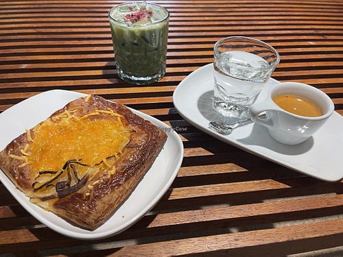 French onion danish with oat milk iced dairy duster matcha and house blend espresso   at Presta Coffee Roasters in Tucson