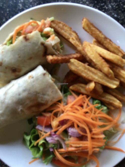 Apologies for the blurry photo. Hummus wrap with seeds and nuts, chips and salad.  at Bohemiaz Resort & Spa in Kampot