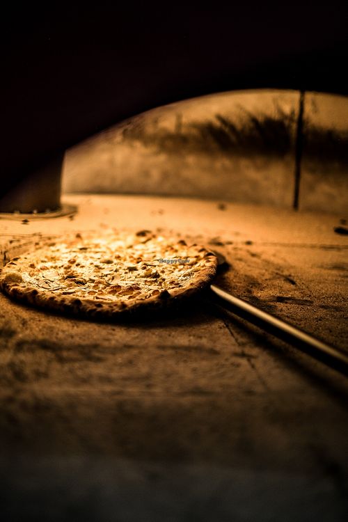 Get ready to feast your eyes on the mouth-watering sight of our vegetarian and vegan pizza cooking to perfection in our traditional wood-fired style oven at Papa G's Pizzeria in Blacktown