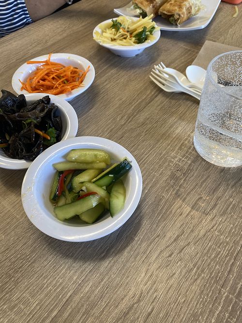 Avocado Rolls, Sides Pictured: Pickled Cucumber, Wood Ear Mushrooms, Shredded Carrots w/Cilantro, Seaweed Salad (not in frame), and Shredded Potato Salad.  at Happiness Cafe in San Jose