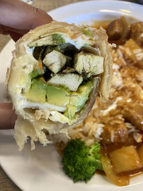 Avocado Roll - Roti, Cabbage, Vegan Chick’n’ Strips, Fresh Avocado, Carrots. 😋  at Happiness Cafe in San Jose