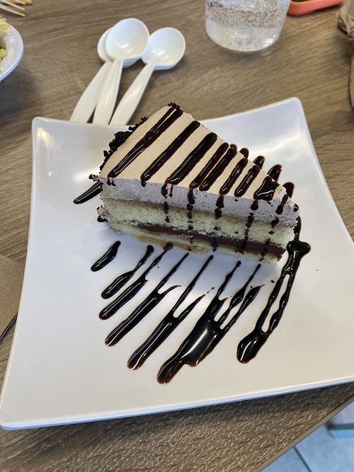 Vegan Cake Slice w/Extra Chocolate Sauce to Share 😋  at Happiness Cafe in San Jose