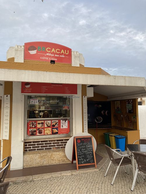 The kiosk has a couple outside tables for customers.  at BRCACAU COFFEE & MORE in Leiria