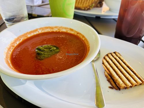 Tomato basil soup with vegan bread, Vegan Delight Smoothie and unsweetened iced tea in the background   at Something Healthy Cafe in Sierra Madre