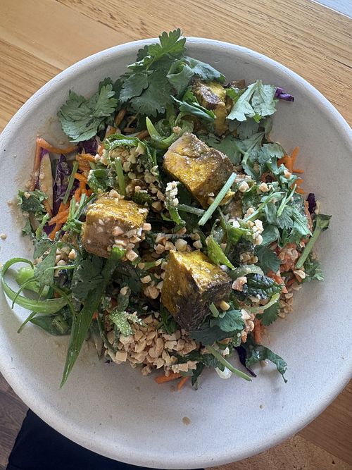 Spiced tofu satay lunch bowl with kale slaw, lime, coriander, mint, shallots, satay dressing and crushed peanuts $18  at Clean Bowled in Bright