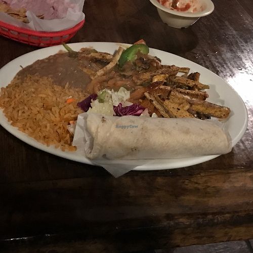 Vegan chicken ranchero with rice, beans and tortillas  at Pokez in San Diego