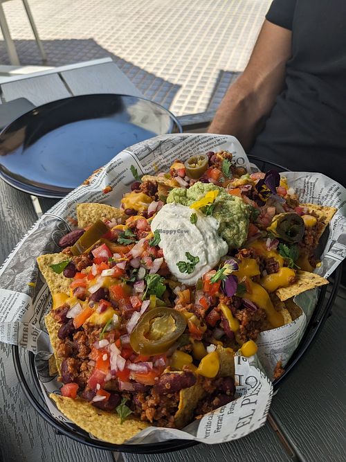 Vegan Nachos big enough for two. at Rúkula Vegan Food in Malaga