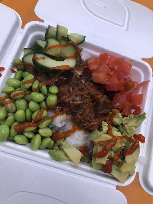 Jasmine rice, bbq jackfruit, cucumbers, tomatoes, edamame beans, avocado & siracha   at Space Bowl Bistro in Merritt Island