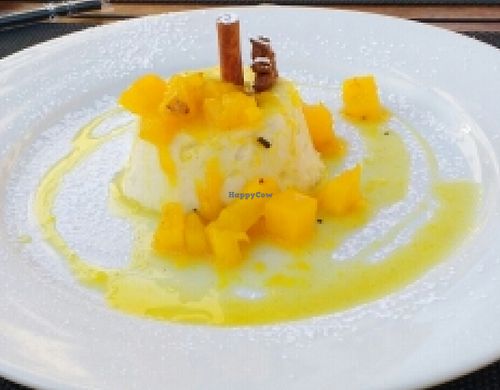 Coconut pudding with fruit reduction. at Essencia in Porto