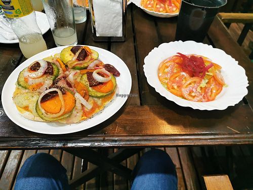 Pizza with cheese made of potatoes and a salad at Wicz Bar in Puerto Iguazu