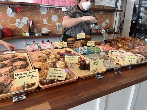 The vegan has a sticker to clearly indicate   at Hopscotch Bakery & Market in Champaign