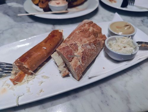 Vegan cheese sausage, looks messy because I had already started eating at Cafe Europa in Vienna