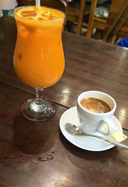 Carrot/ ginger juice and espresso at Tree House Cafe  in Phong Nha