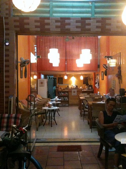 Inside the coffee, nice and cosy decoration, some books... at Cafe Soleil in Phnom Penh