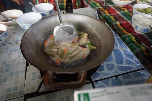 Cooking with On in her lovely small kitchen outside at On's Thai Isaan in Kanchanaburi