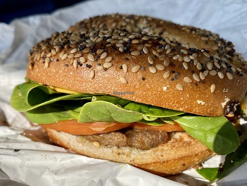 Vegan bagel sandwich- everything bagel, beyond sausage, tomato, spinach, vegan cheese    at GiraKofi in Stowe