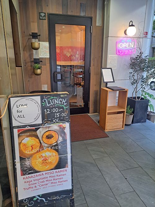 Entrance area and signage at Love For All in Kanazawa
