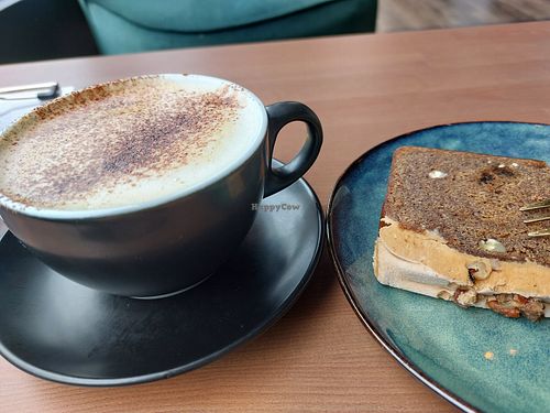 Oat milk decaf Cappuccino and pecan coffee cake at Oscar's Cafe in St Neots