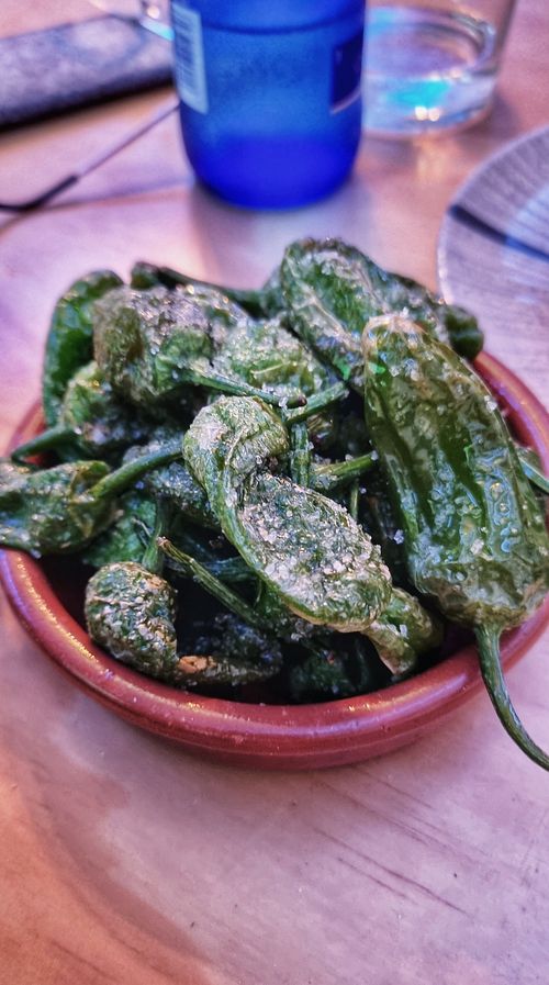 Pimientos del padrón fritos (veery salty) at La Vegana Taperia Playa in Torre Del Mar