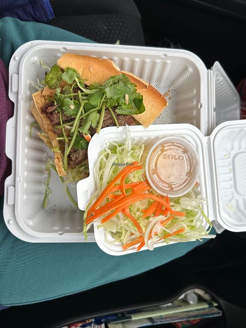 Half of the Vegan Bahn Mi - the other half was delicious! Plenty of veggies under the fried tofu slices and faux meat strips, the small box of extras and dressing are a salad !  at M&T Restaurant in Silverdale