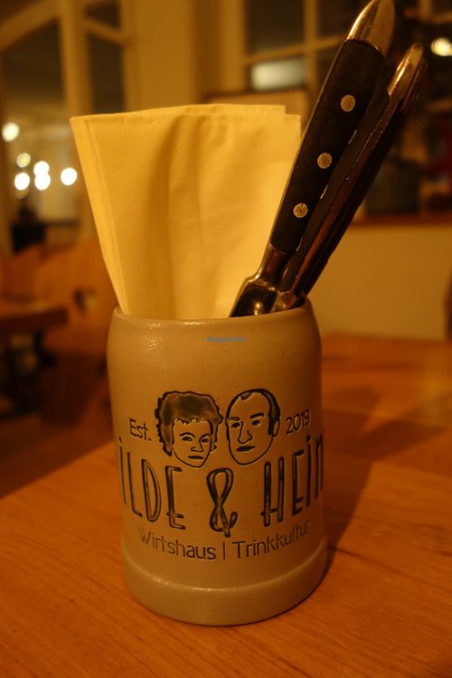 The cutlery in a jug with their logo at Hilde & Heinz in Saarbrucken