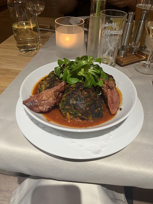 Spinach and sweet potato burger on tomato sauce with planted steak   at Hotel Markgraf Restaurant Korbbogen in Kloster Lehnin