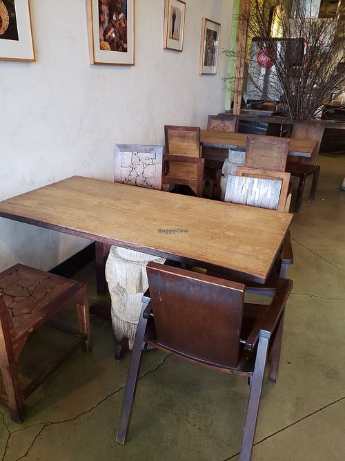 Wooden tables and chairs that are just beautiful and unique. at Falafel King in Denver