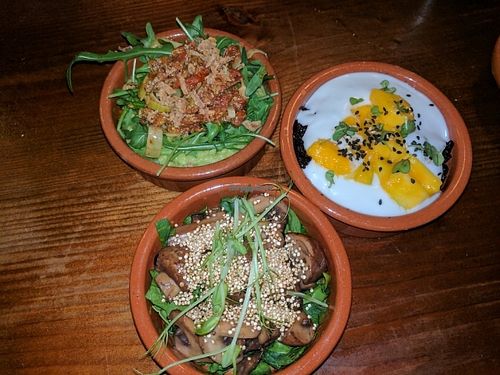 3 tapas of the day. pea puree with sundried tomatoes, black rice with coconut cream and mango, mushroom and quinoa salad.  at The Food Temple in Lisbon