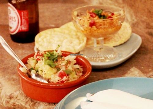 tapas on the stairs (hummus and quinoa salad) at The Food Temple in Lisbon