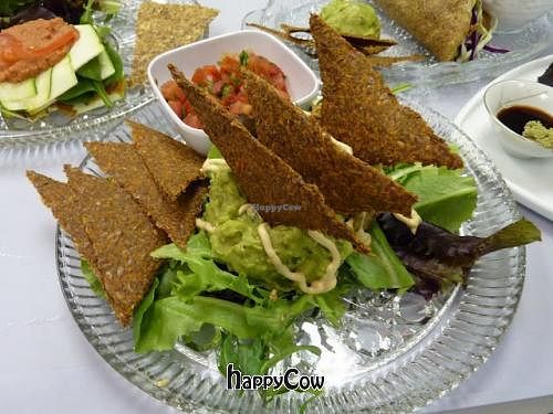 I love the nachos! Dehydrated chips, fresh guacamole, cashew sour cream, pico de gallo... yum yum! at Raw Intentions Kitchen in Broken Arrow