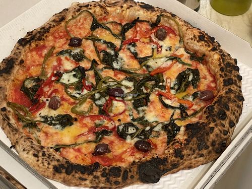 Calzone (stuffed with vegan mozzarella, deep-fried aubergines and mushrooms) and vegan margherita topped with friarielli, black olives and bell peppers   at Sacro Dough Pizza in North West London