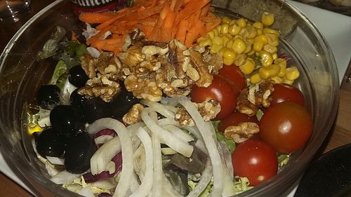 Salad with fresh vegetables and walnuts at B13 Bar in Madrid