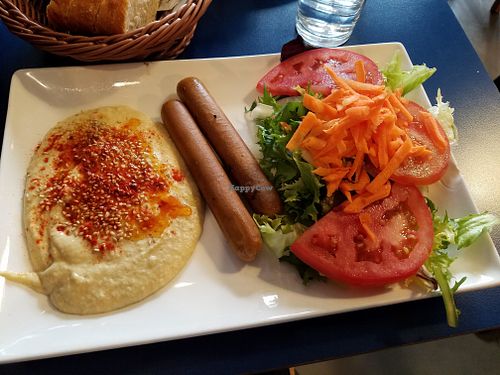 "Sausage" with hummus and salad at B13 Bar in Madrid