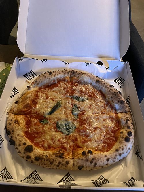 Margherita pizza with vegan cheesee  at Weźże Krafta in Krakow