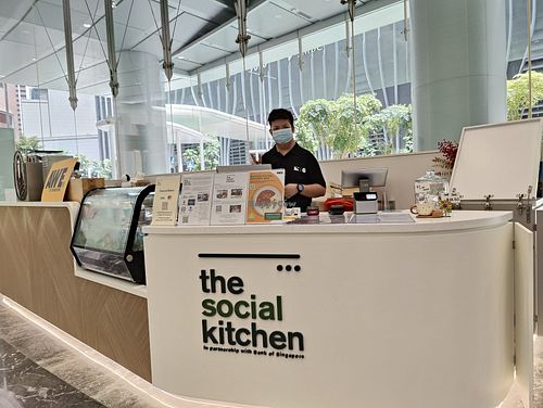Shop front with staff Michael Ang at The Social Kitchen - Raffles Place in Central Singapore