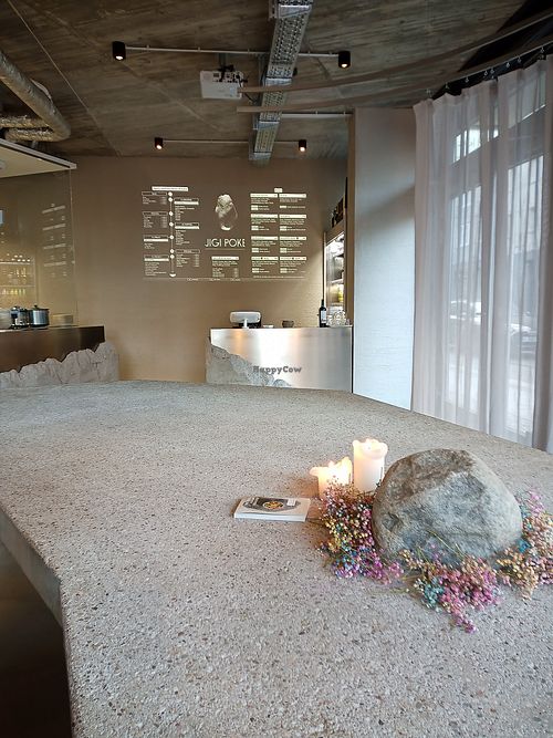 Menu projected onto wall at JIGI Poke in Berlin