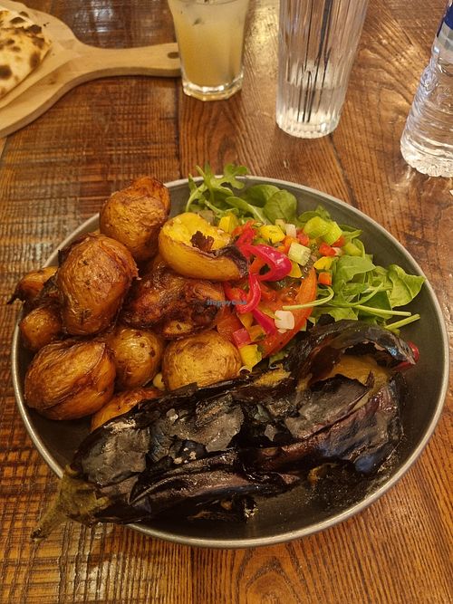 Rotisserie aubergine with fried baked potatoes and chopped salad. at Forum Kitchen + Bar in Sheffield
