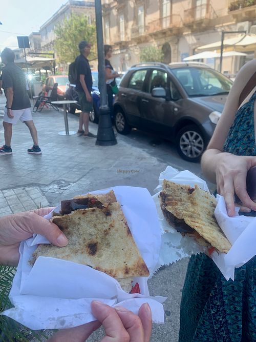 Maddie & Lyn eating the pizzolo at Vegan Food Tour Ortigia in Siracusa