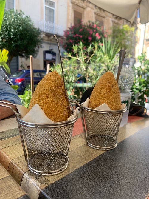 Claire and Jay, and Arancini at Vegan Food Tour Ortigia in Siracusa