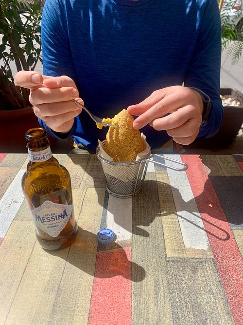 Nothing pairs better with arancini than a Sicilian beer - April 2024 at Vegan Food Tour Ortigia in Siracusa