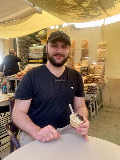 Deciding on his favorite flavor of gelato - April 2024 at Vegan Food Tour Ortigia in Siracusa