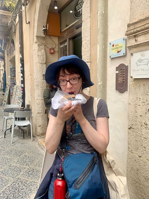 Rebecca enjoying the crostata - April 2024 at Vegan Food Tour Ortigia in Siracusa