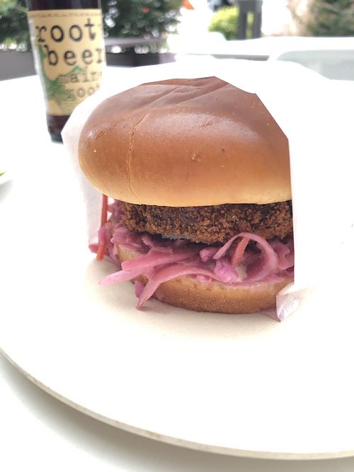 Crab cake sandwich with slaw  at Veggie Grill by Next Level - University Village in Seattle