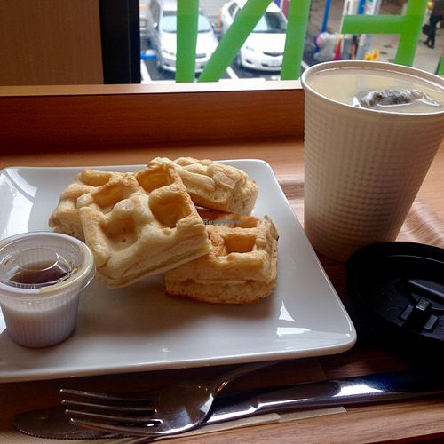 Brown rice waffles with maple syrup, and tea with soy milk. at Genmai Cafe in Osaka