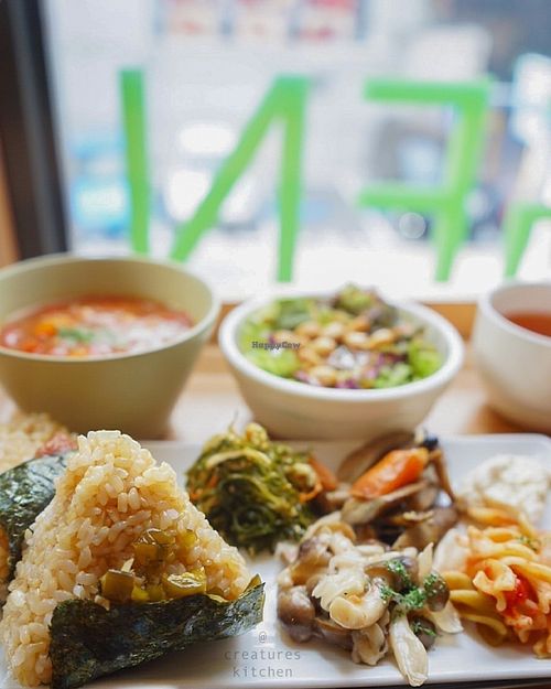Shokujidouzen lunch set with brown rice onigiri, minestrone soup, salad, brown rice tea, and deli items.  at Genmai Cafe in Osaka