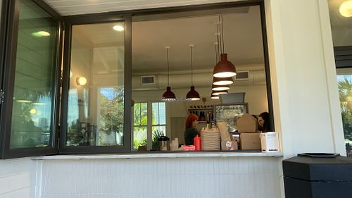 Window from inside to outside   at Pete's Bagels and General Store in Tampa