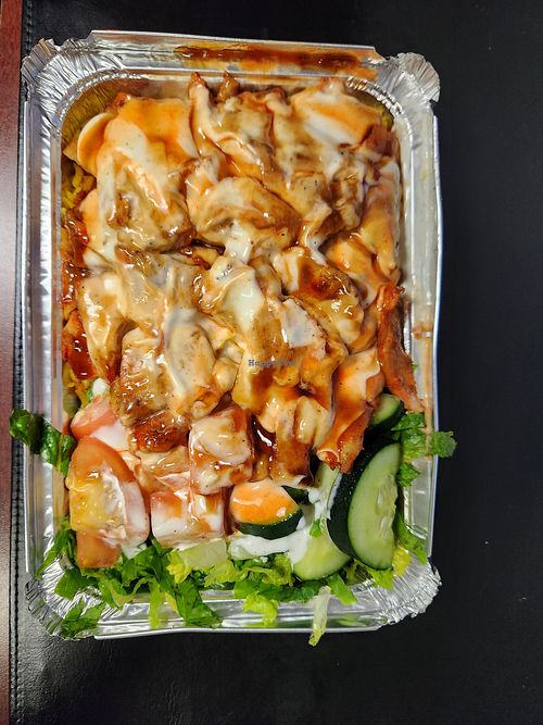 Halal chicken over rice with salad. Vegan mayo and hot sauce! On point! at Plantega - Nadal 3 Deli in Bronx